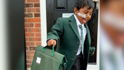 Noah in his school uniform