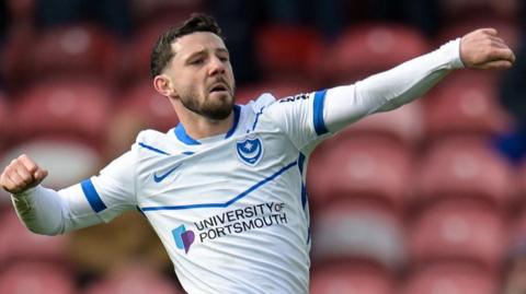 Conor Chaplin celebrates scoring a goal for Portsmouth