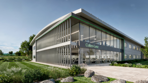 A grey and green building with grass on the left. A sign says 'Callen-Lenz'