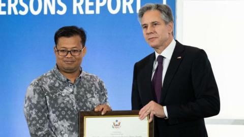 US Secretary of State Antony Blinken stands with Mech Dara, a 2023 Trafficking in Persons (TIP) Report Hero, for his work in Cambodia