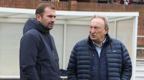 Neil Warnock (right) chats with Paul Wotton (left) 