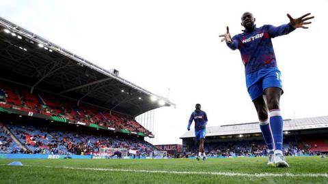 Mateta warms up