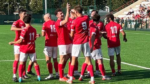 Jersey Bulls celebrate Lorne Bickley's goal