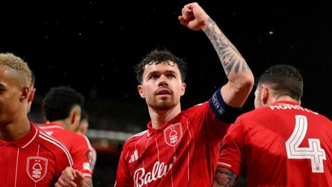 Neco Williams with his fist in the air