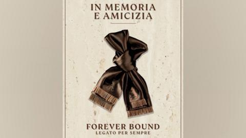 An image of a bronze coloured scarf tied in a loose knot against a cream background. Text above the scarf reads "In memoria e amicizia". Text below the image reads "Forever bound. Legato per sempre".
