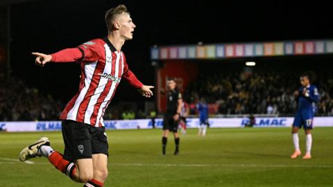 Rob Street celebrates his goal for Lincoln against Chelsea