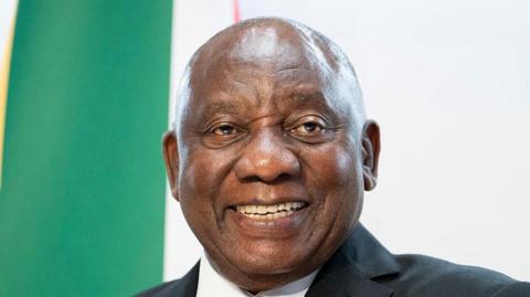 A smiling South African president Cyril Ramaphosa is seen at an event