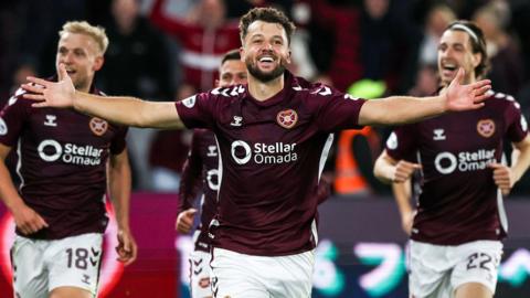 Craig Halkett celebrates