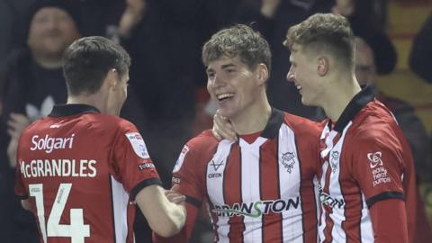 Lincoln City celebrate a goal