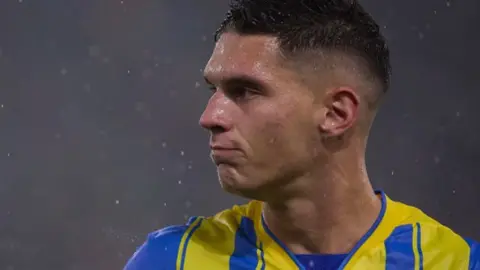 Shakhtar Donetsk player reacts after missing penalty