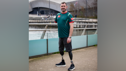 Handout photo issued by the Army Benevolent Fund of Andy Reid, an Afghanistan veteran and triple amputee, during a training walk for the TCS London Marathon at Salford Quays.