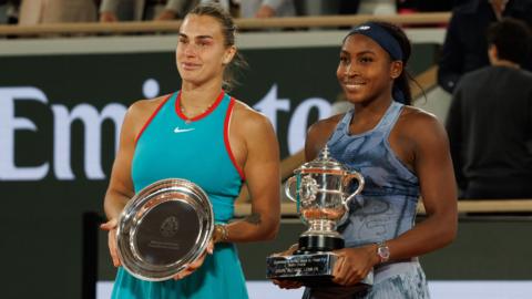 Aryna Sabalenka and Coco Gauff with their respective French Open trophies