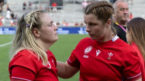 Wales co-captains Alex Callender and Kate Williams console each other in defeat