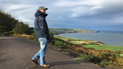 Man looking out to North Sea