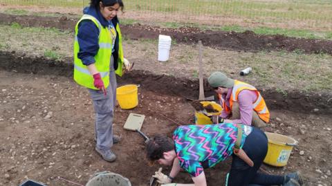 The moment students discovered a shard of Roman pottery