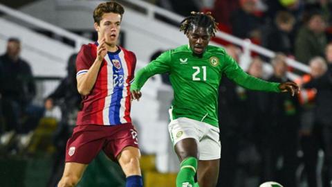 Sverre Nypan, pictured in action for Norway Under-21s, battles with Baba Adeeko of Republic of Ireland