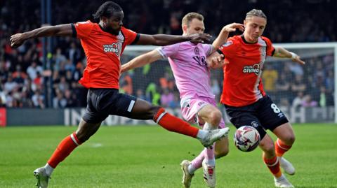 Luton Town's Millenic Alli and Thelo Aasgaard challenge for the ball during the 1-0 loss at home to Blackburn