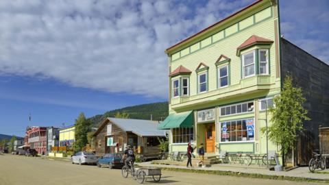 Historic building and traditional wooden building in Dawson City, Yukon Territory, Canada, a Klondike gold rush town.
