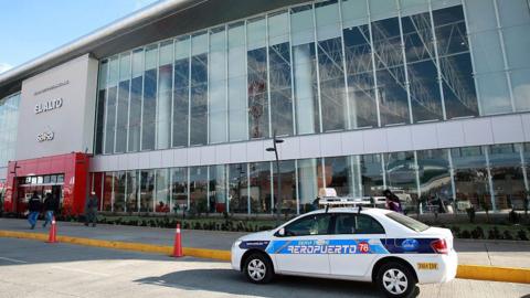 An airport taxi is parked outside the El Alto International Airport, which completed construction earlier this year, in El Alto, Bolivia, on Tuesday, Oct. 20, 2015