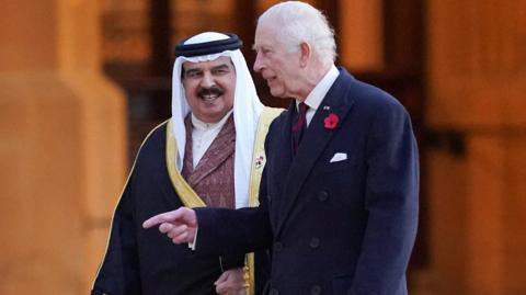 King Charles (R) and Bahrain's King Hamad bin Isa Al Khalifa (L), walk after inspecting the Guard of Honour at Windsor Castle, Berkshire (11 November 2024)