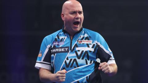 Rob Cross celebrates his win over Peter Wright