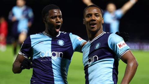 Richard Kone (right) of Wycombe Wanderers celebrates after scoring a goal