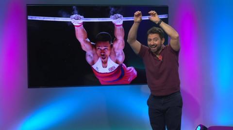 Ricky pretending to be a gymnast