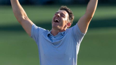 Rory McIlroy celebrates winning the Masters title