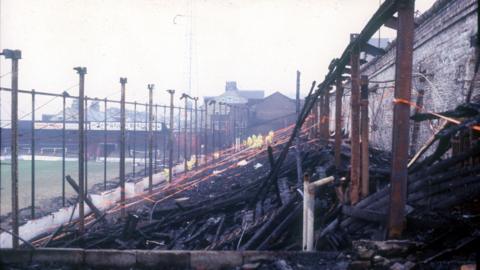 The blackened stands at the scene at Valley Parade in 1985 after the fire 