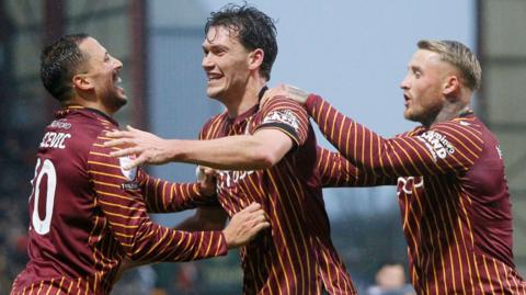 Bradford City's Joe Wright (centre) celebrates his goal against Exeter City