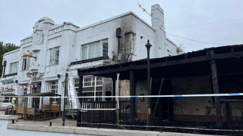 A pub front damage by a fire