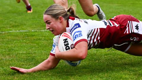 Ellise Derbyshire scores a try for Wigan against Leeds