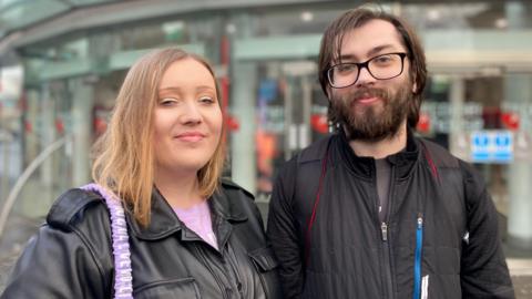 A man and woman stood in front of Nottingham's cornerhouse