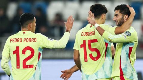 Spain celebrate scoring a goal