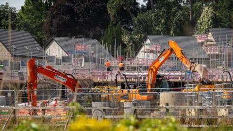 A stock image of a building site in the UK, where new homes are being constructed.