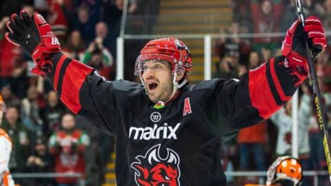 Joey Martin arms outstretched after scoring a goal