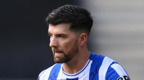 Jordan Jones playing for Wigan last season