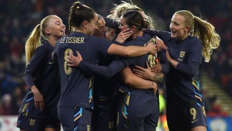 Grace Clinton celebrates scoring for England against Switzerland