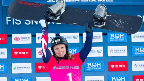 Great Britain's Charlotte Bankes celebrates winning snowboard cross World Cup event in China