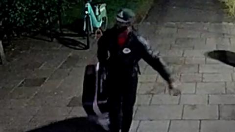 CCTV shows Yostin Mosquera dragging a suitcase