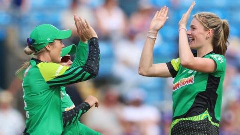 Southern Brave's Lauren Bell celebrates a wicket with Georgia Adams