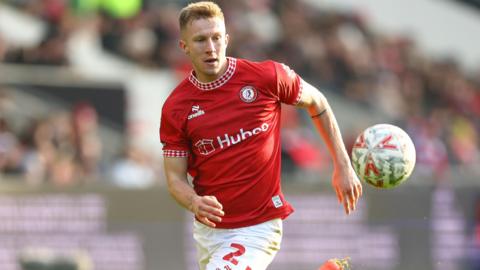 Ross McCrorie running with the ball during a game for Bristol City