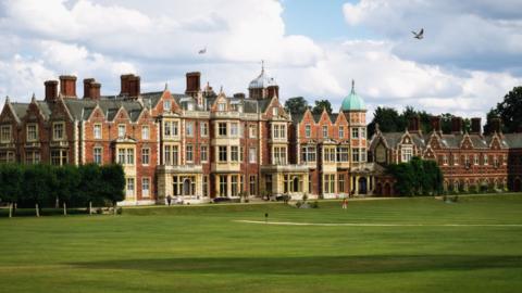 Sandringham House - the main house on the estate. It is a large building with a green lawn in front