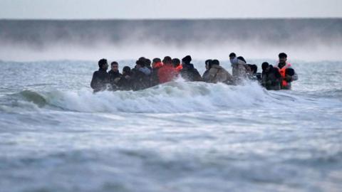 Several people on board a small boat in the Channel