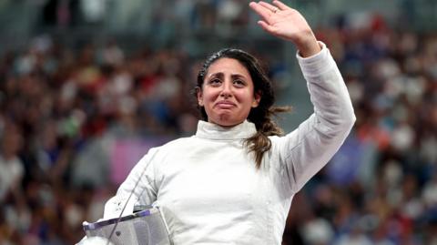 Nada Hafez of Egypt applauds fans after her victory against Elizabeth Tartakovsky at the Paris 2024 Olymics