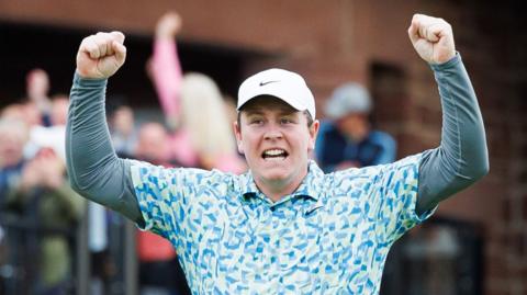Robert MacIntyre of Scotland celebrates as he wins the 2024 Genesis Scottish Open trophy during the 2024 Genesis Scottish Open Fourth Round at The Renaissance Club