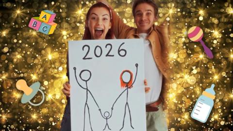 Dianne and Joe celebrate holding up a painting of three stick figures holding hands and it says 2026 at the top. The picture is on a glittery background with cartoon baby items around them
