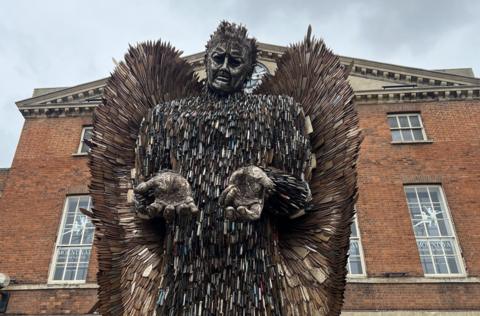 The Knife Crime Angel, a large statue made entirely of blades and standing outside county hall in Taunton with its hands outstretched in front