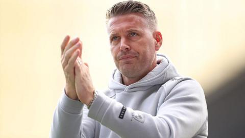 Rob Edwards claps the fans during a Middlesbrough game