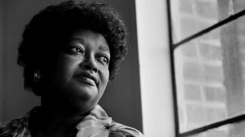 American Civil rights activist Claudette Colvin, 7th April 1998 looking out a window in a black and white photo